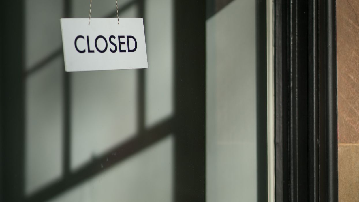 Closed sign hanging on a door