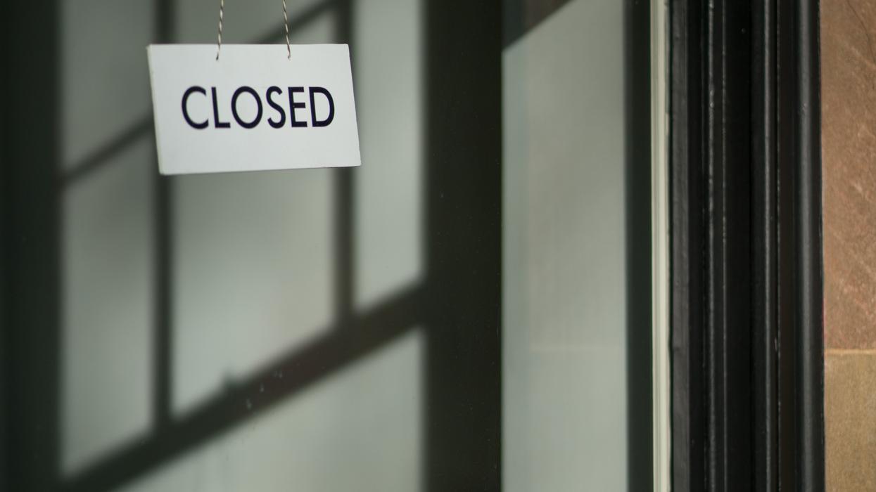 Closed sign hanging on a door