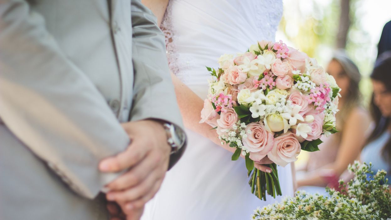 Closeup of bride and groom's hands