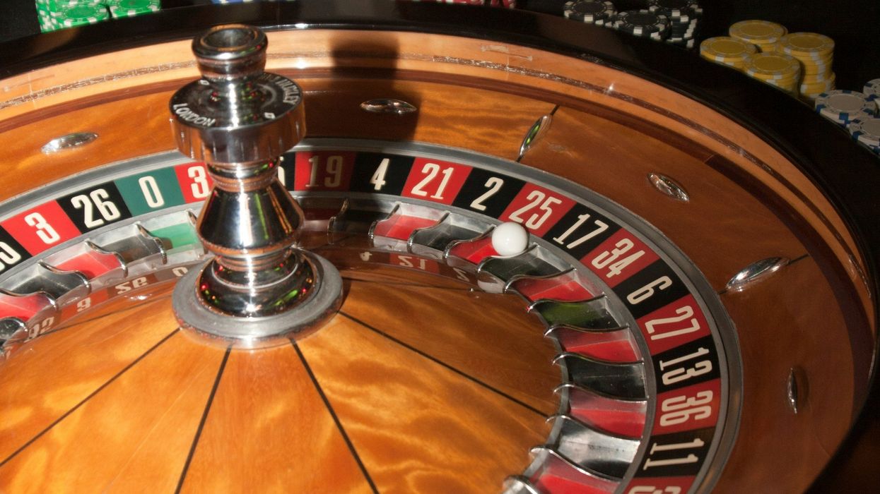 Closeup on chips at a roulette wheel