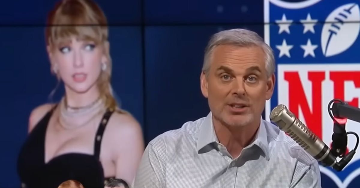Colin Cowherd in front of a screen image of Taylor Swift