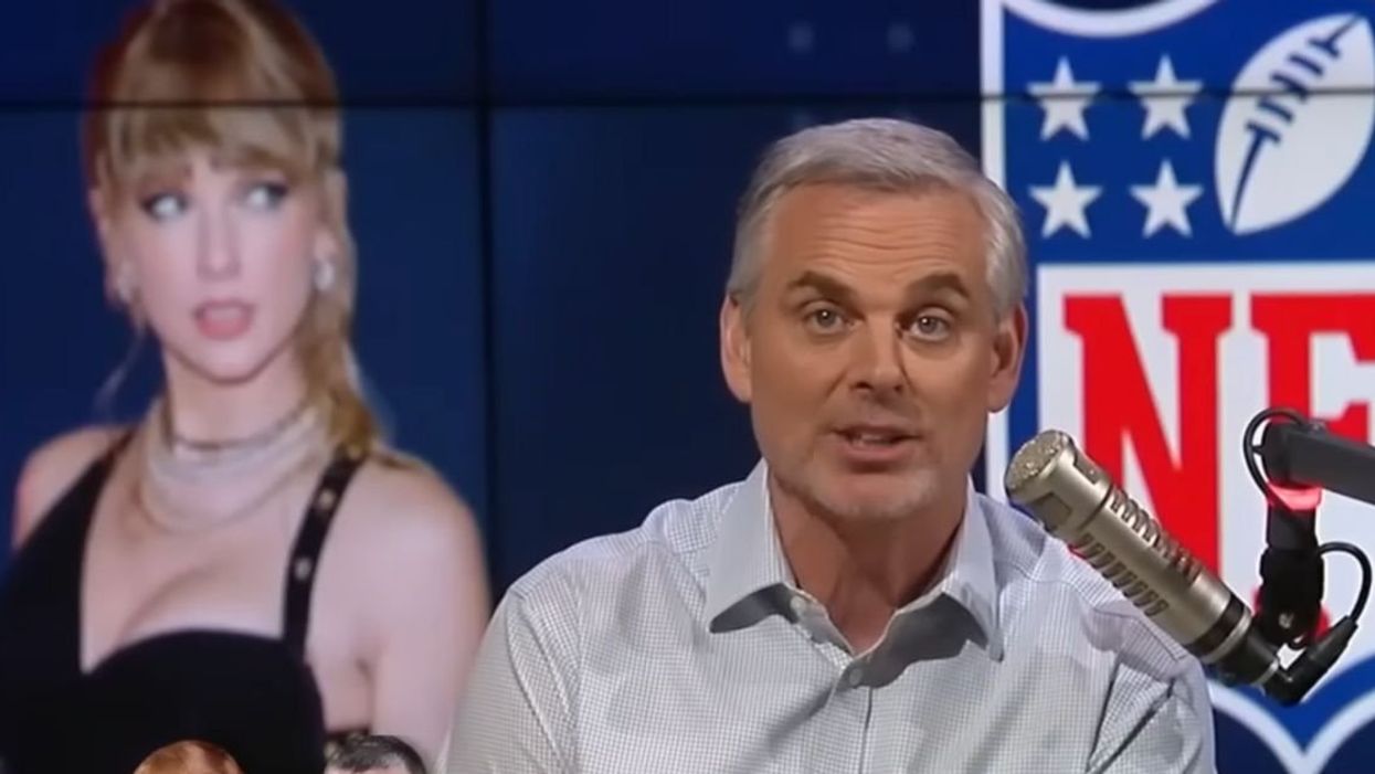 Colin Cowherd in front of a screen image of Taylor Swift