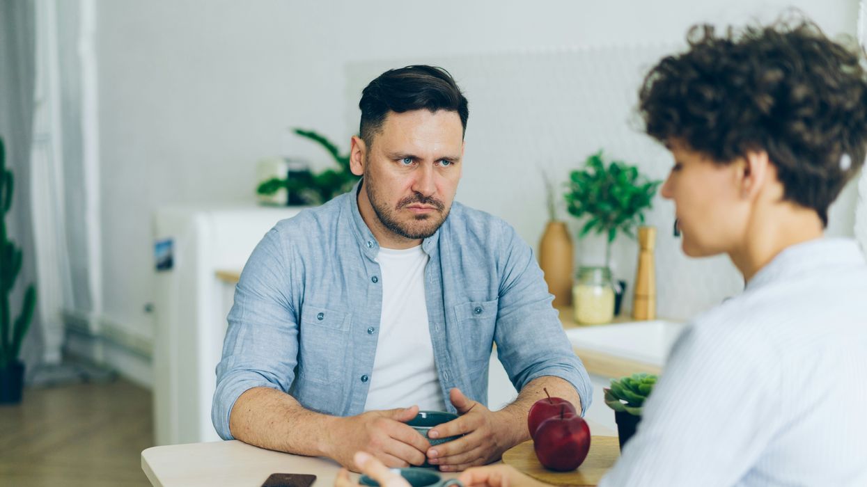 Couple arguing at table