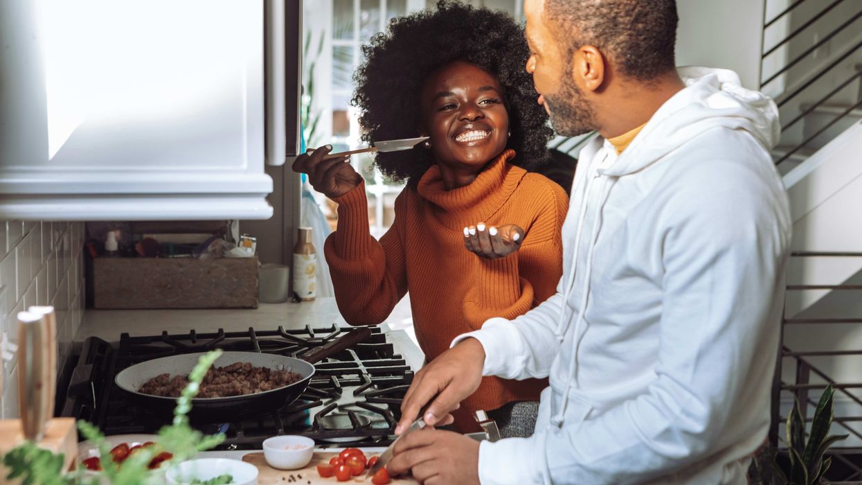 couple cooking meal together