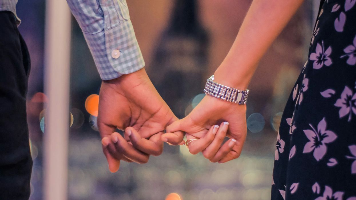 Couple holding hands