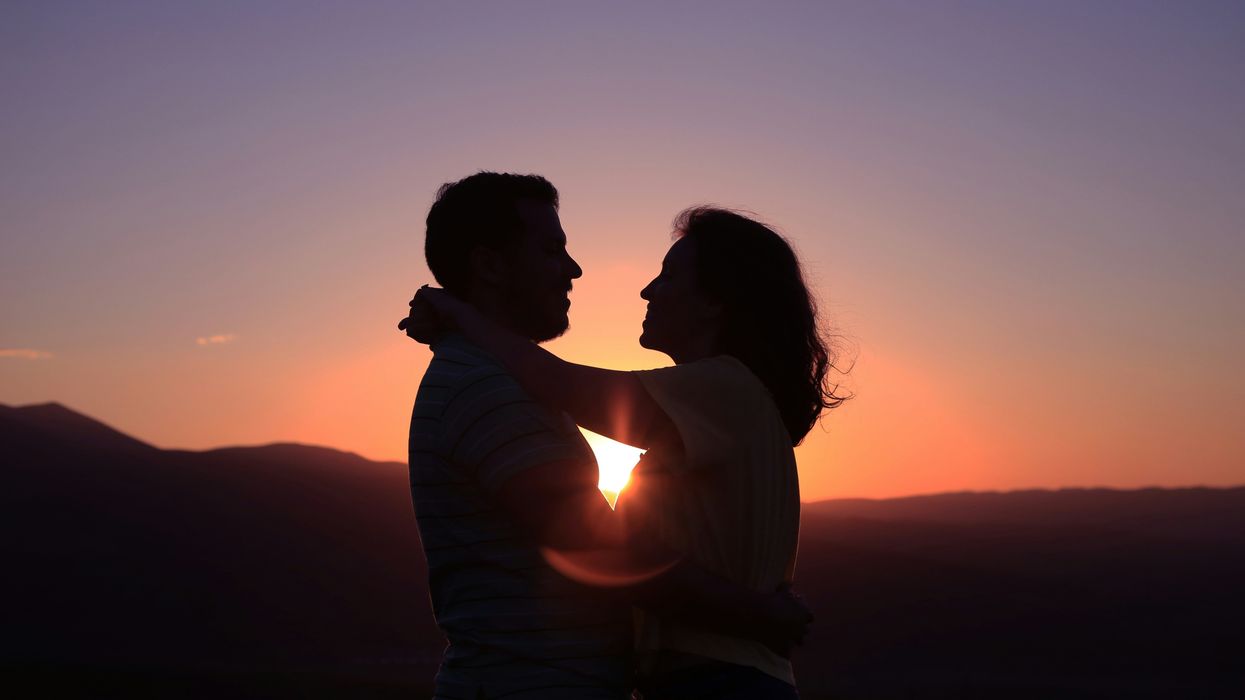 Couple hugging in the sunset