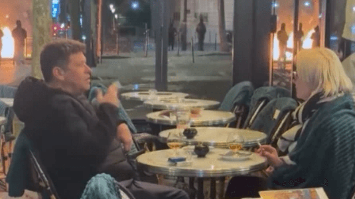 Couple in France having drinks during riots