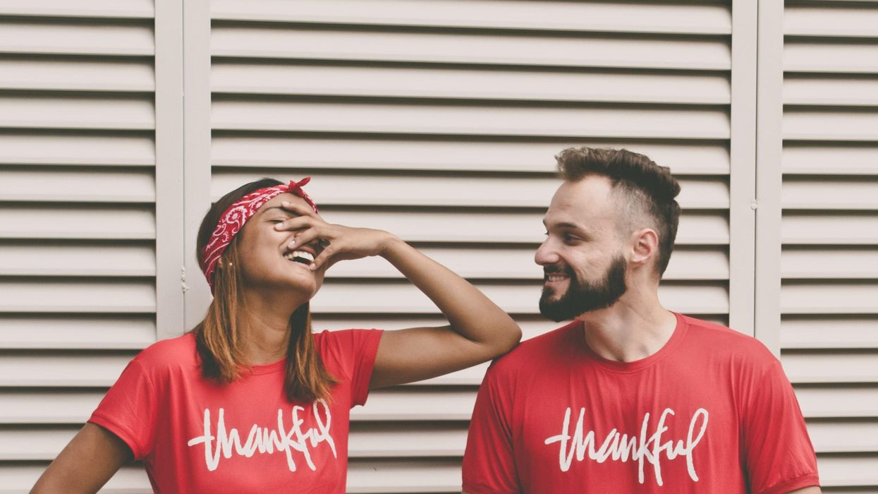 Couple in matching t-shirts acting silly