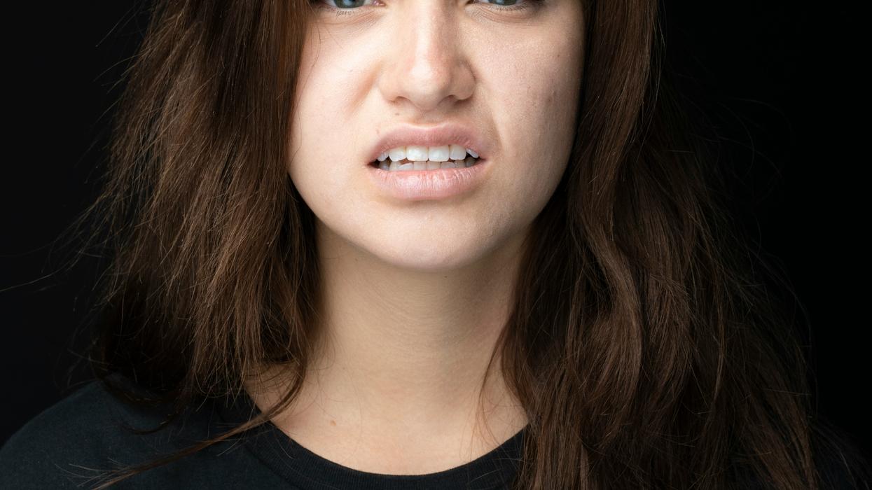 Cringing woman