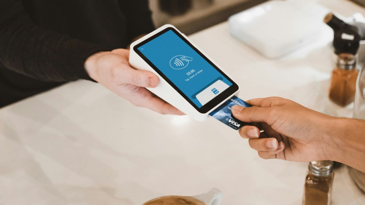 Customer making a credit card transaction with seller