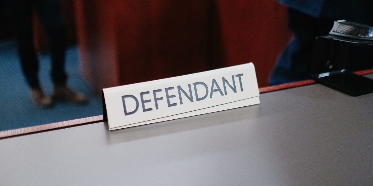 'Defendant' placecard in a courtroom