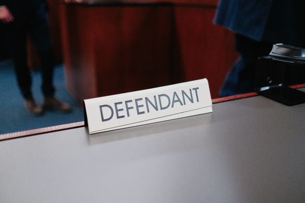 'Defendant' placecard in a courtroom