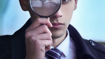 Detective with magnifying glass