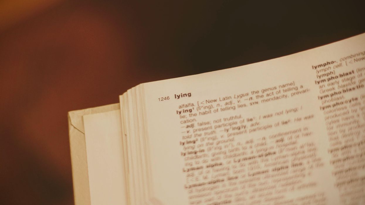 Dictionary open to the page that begins with the definition of "lying"