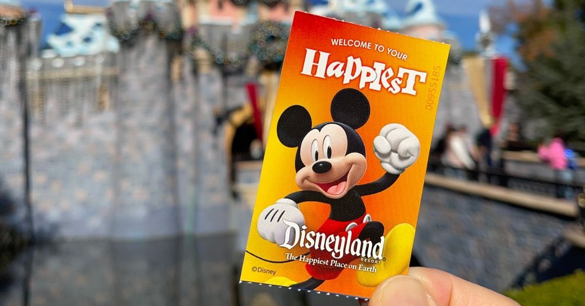 Disneyland park ticket in front of Sleeping Beauty Castle