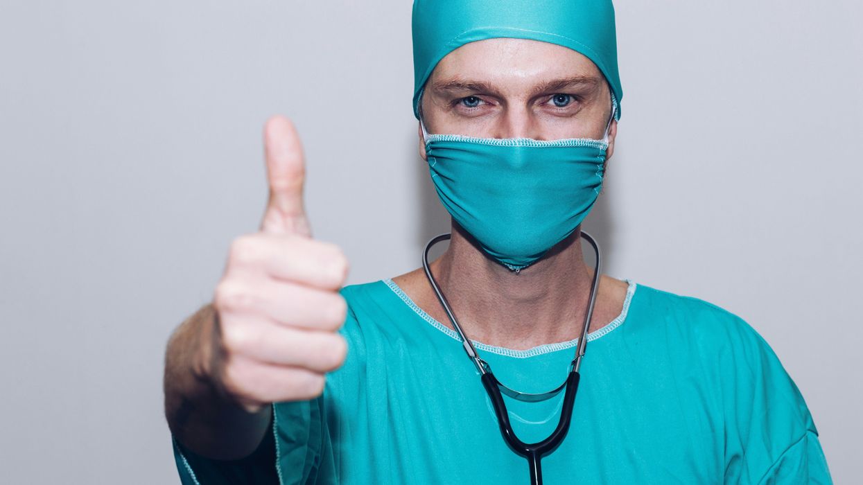 Doctor making a thumbs-up gesture