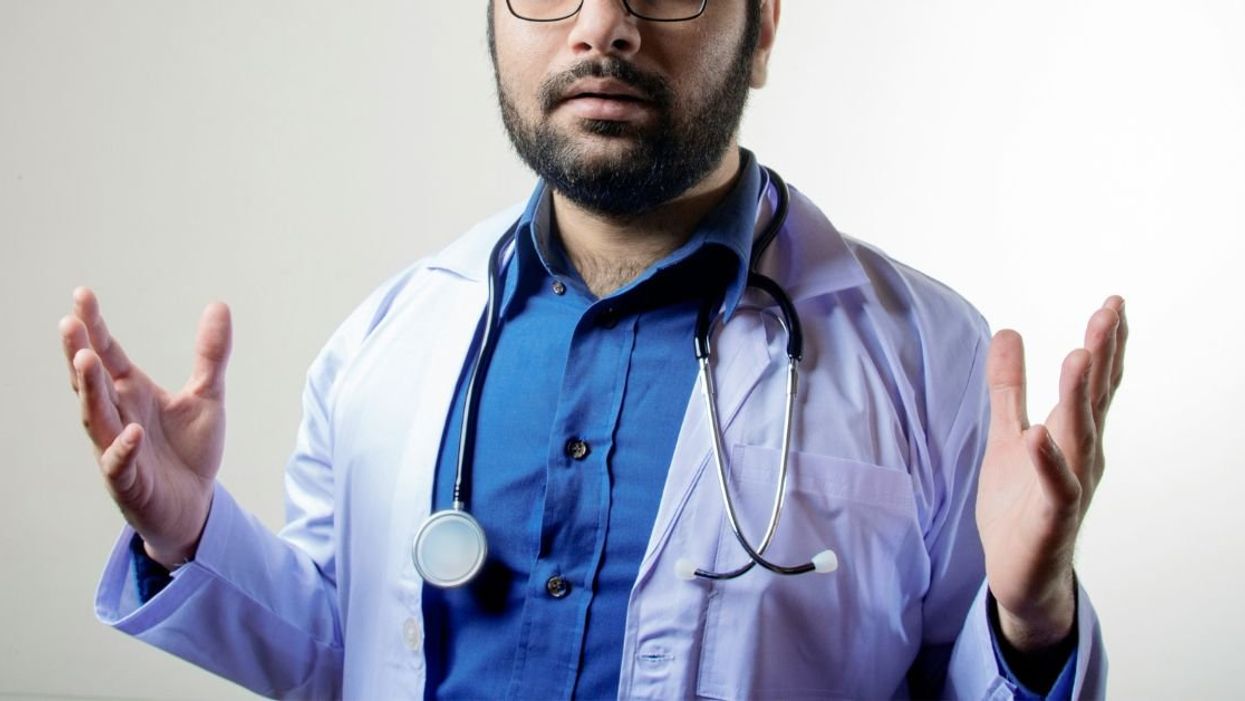 Doctor with both hands out