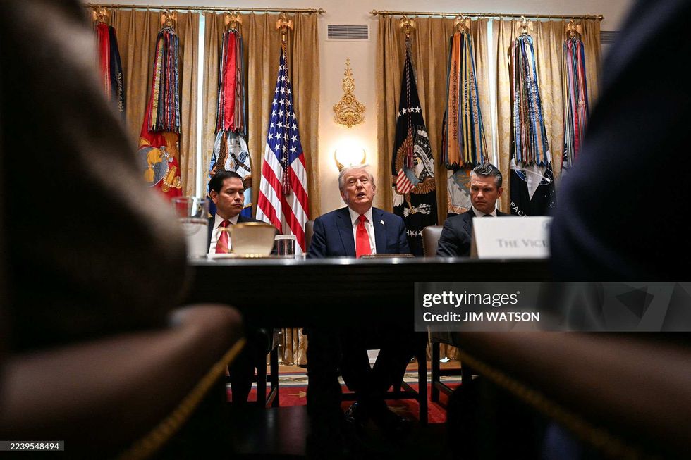 Donald Trump during Cabinet meeting looking like he as devil horns