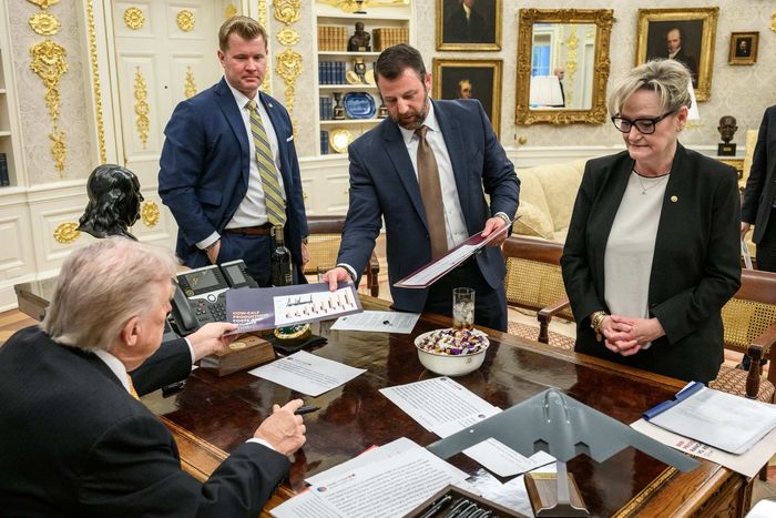Donald Trump has his own tweets across his desk in the Oval Office