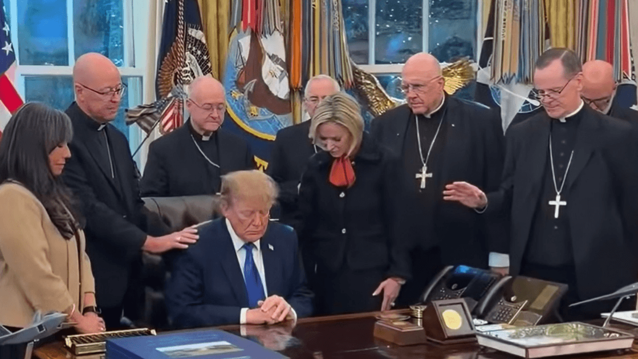 Donald Trump in the Oval Office surrounded by Catholic Bishops and Archbishops