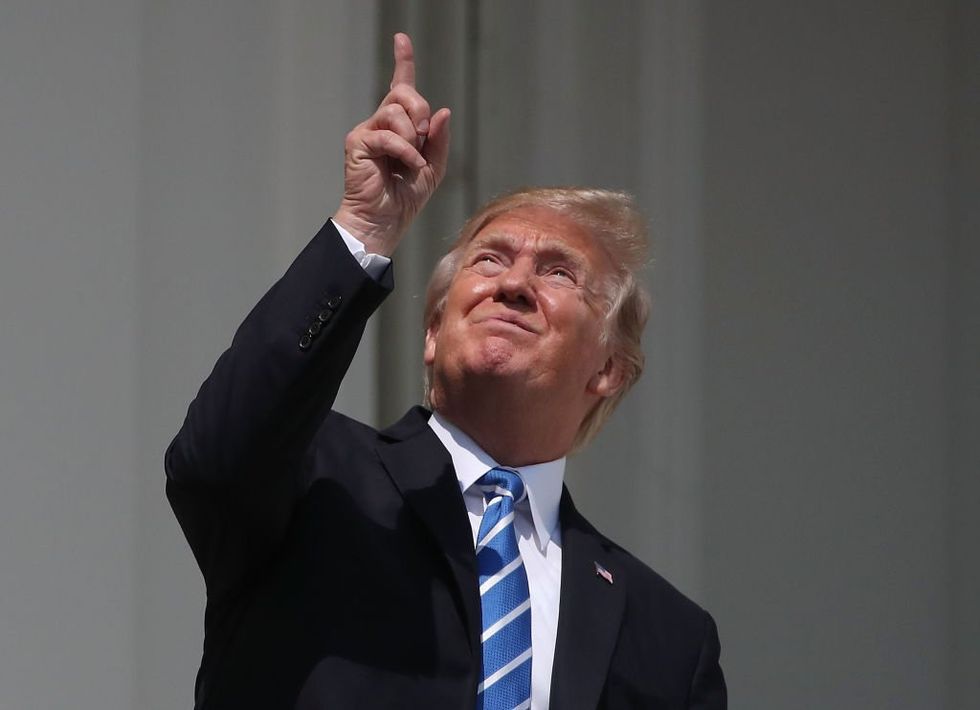 Donald Trump looking at the 2017 solar eclipse