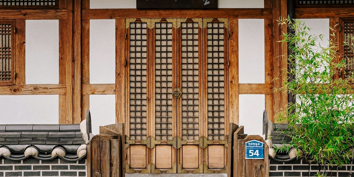 door and steps leading to it with a house number 54