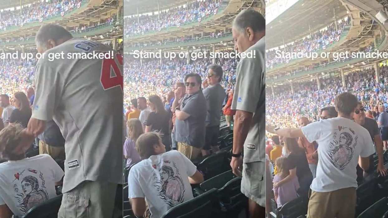 Elderly man smacking a Cubs spectator