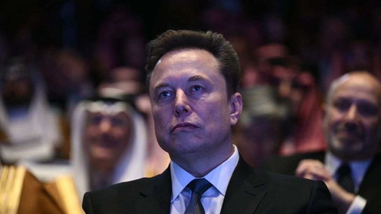 Elon Musk looks on during a public appearance, as the billionaire once again turns a newsroom style decision into a culture-war grievance broadcast to millions on X.
