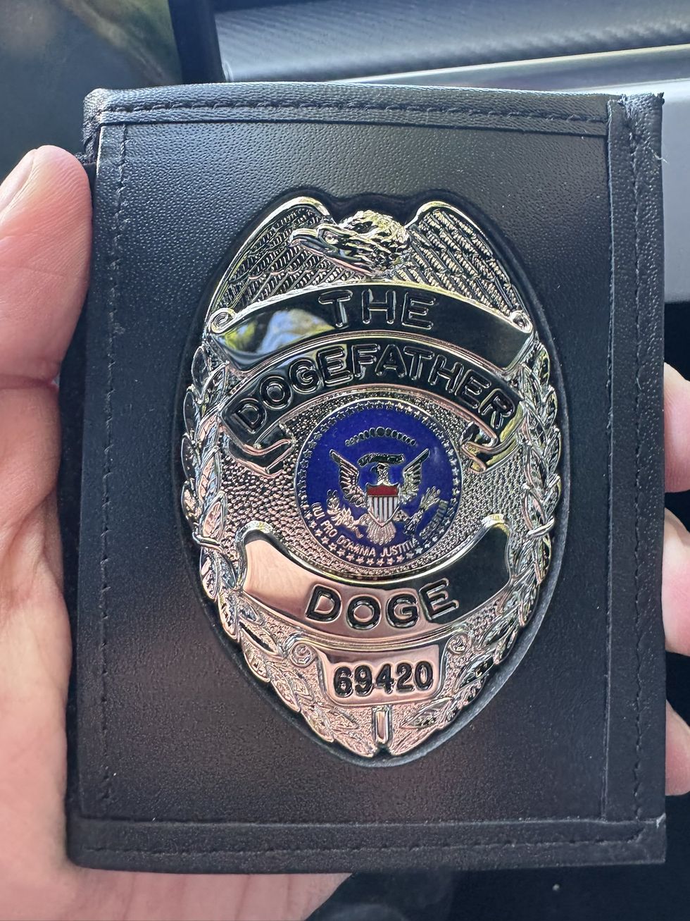 Elon Musk's "Dogefather" badge
