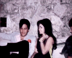 Elvis and Priscilla Presley laugh and kiss