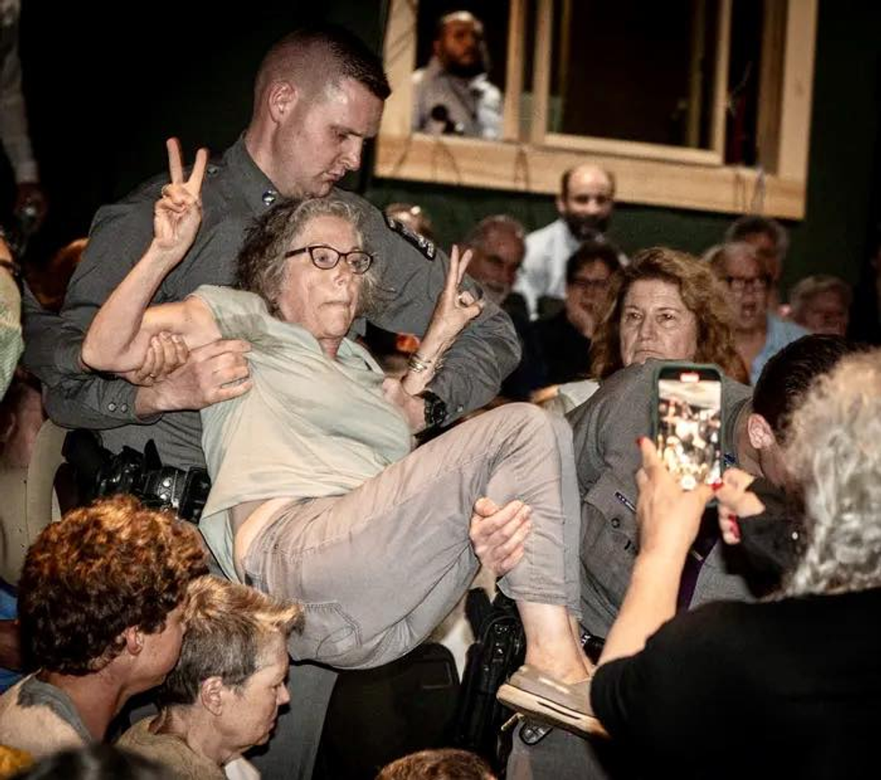 Emily Feiner carried off by state police