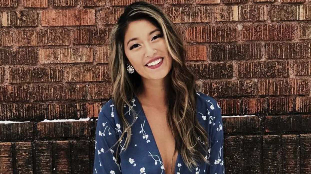 Emma Betsinger, whose arm scars became the center of a Photoshop controversy, poses in a blue floral dress ahead of Love Is Blind Season 10.