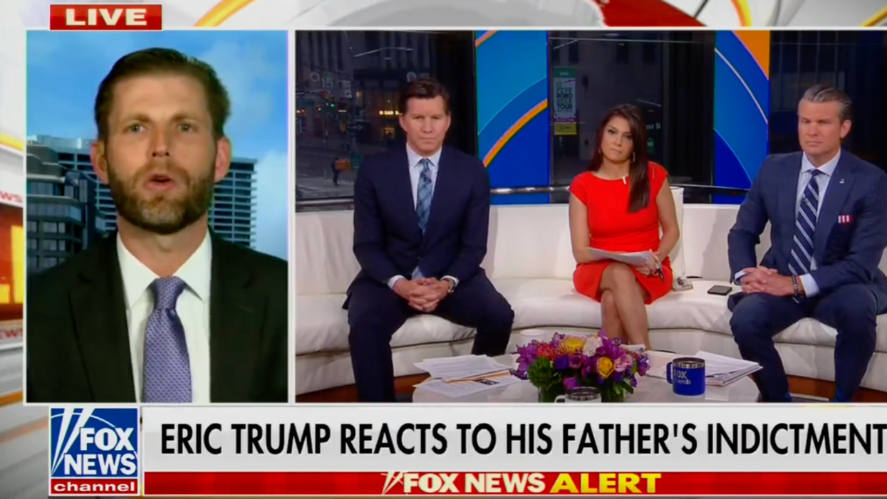 Eric Trump appears on a Fox News broadcast alongside 3 Fox News hosts. The lower third graphic reads "Eric Trump reacts to his father's indictment."