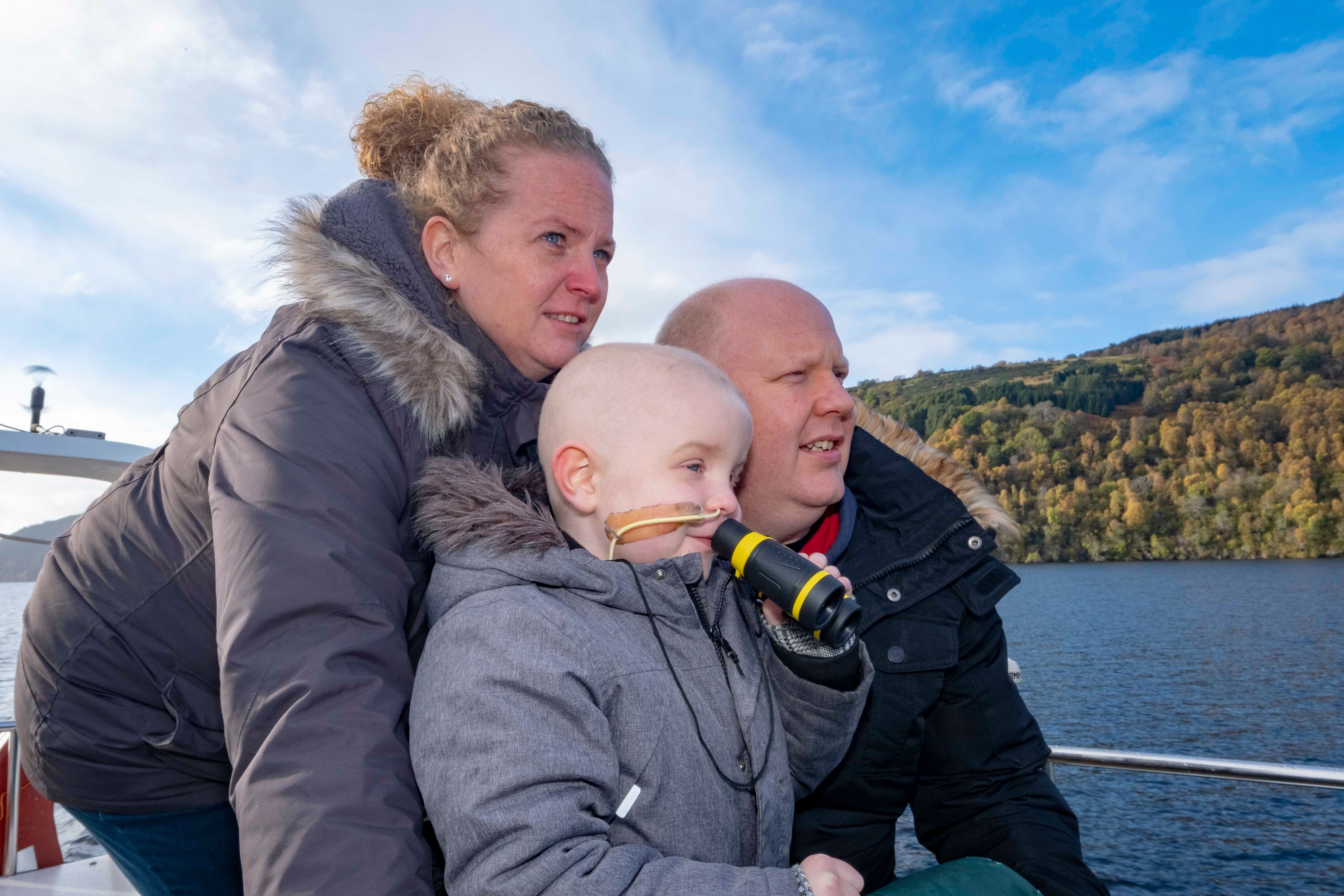 Zachary White with his parents