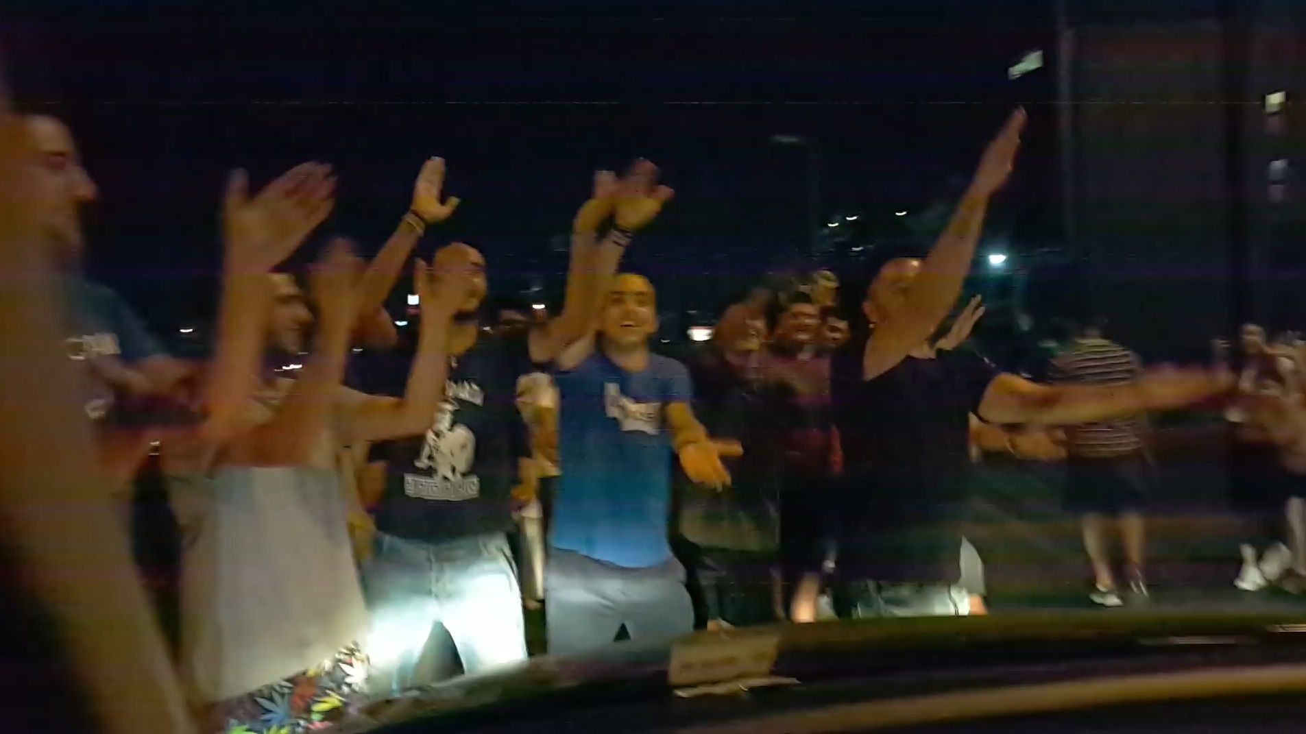 Protesters sing Baby Shark to a toddler in a car