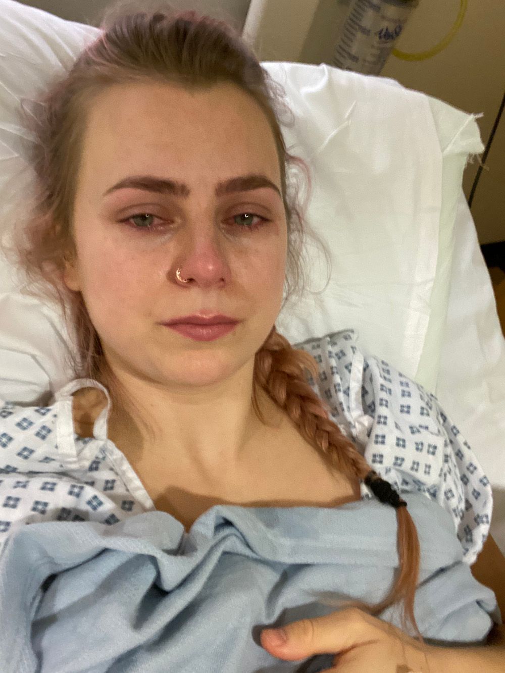 Woman lying in hospital bed