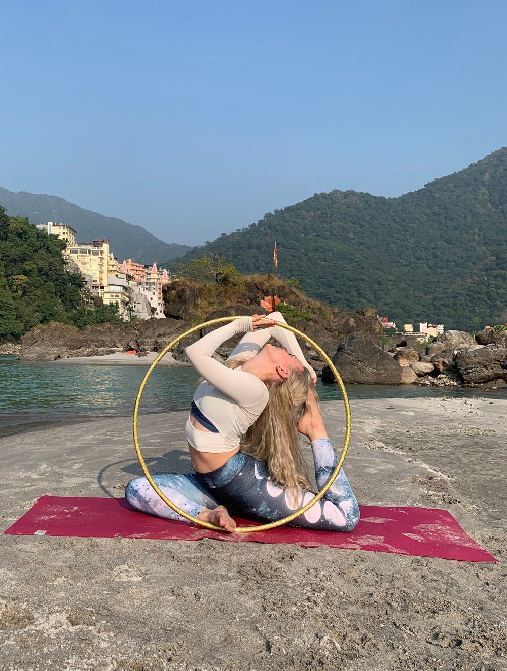 Woman on rooftop inside wooden hoop