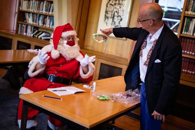 Santas at The Ministry of Fun\u2019s Summer School at Southwark Cathedral, London which aims to create COVID-safe Christmas grottos by teaching Father Christmases how to appear safely in person whilst maintaining the Christmas magic