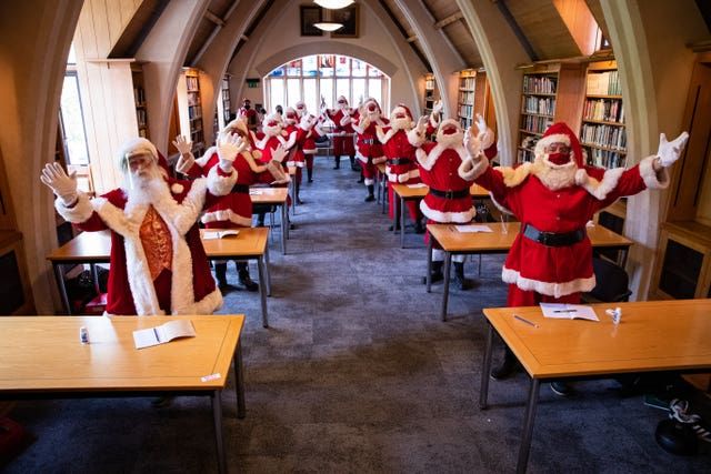 Santas at The Ministry of Fun\u2019s Summer School at Southwark Cathedral, London which aims to create COVID-safe Christmas grottos by teaching Father Christmases how to appear safely in person whilst maintaining the Christmas magic