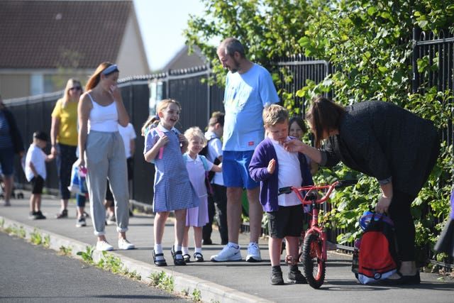 Parents drop off their children at a primary school in Norfolk