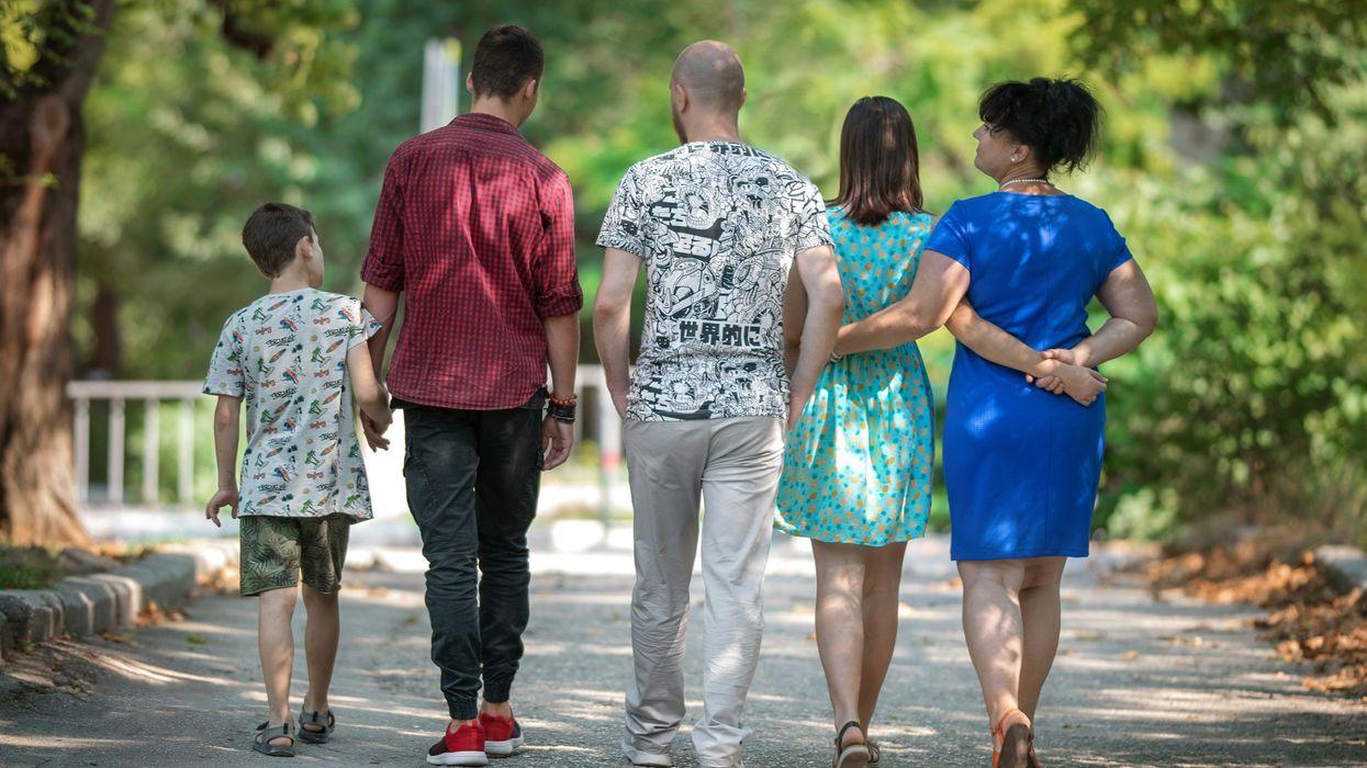 family of five walking away from camera