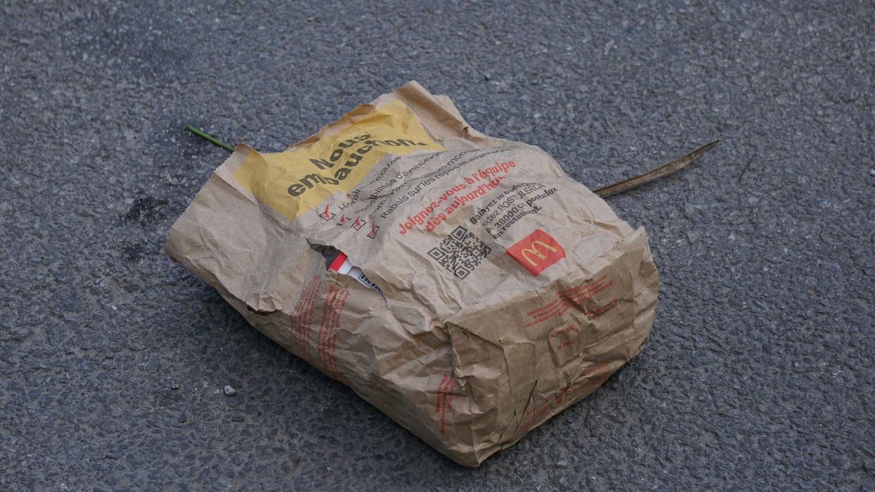 fast food bag on the ground