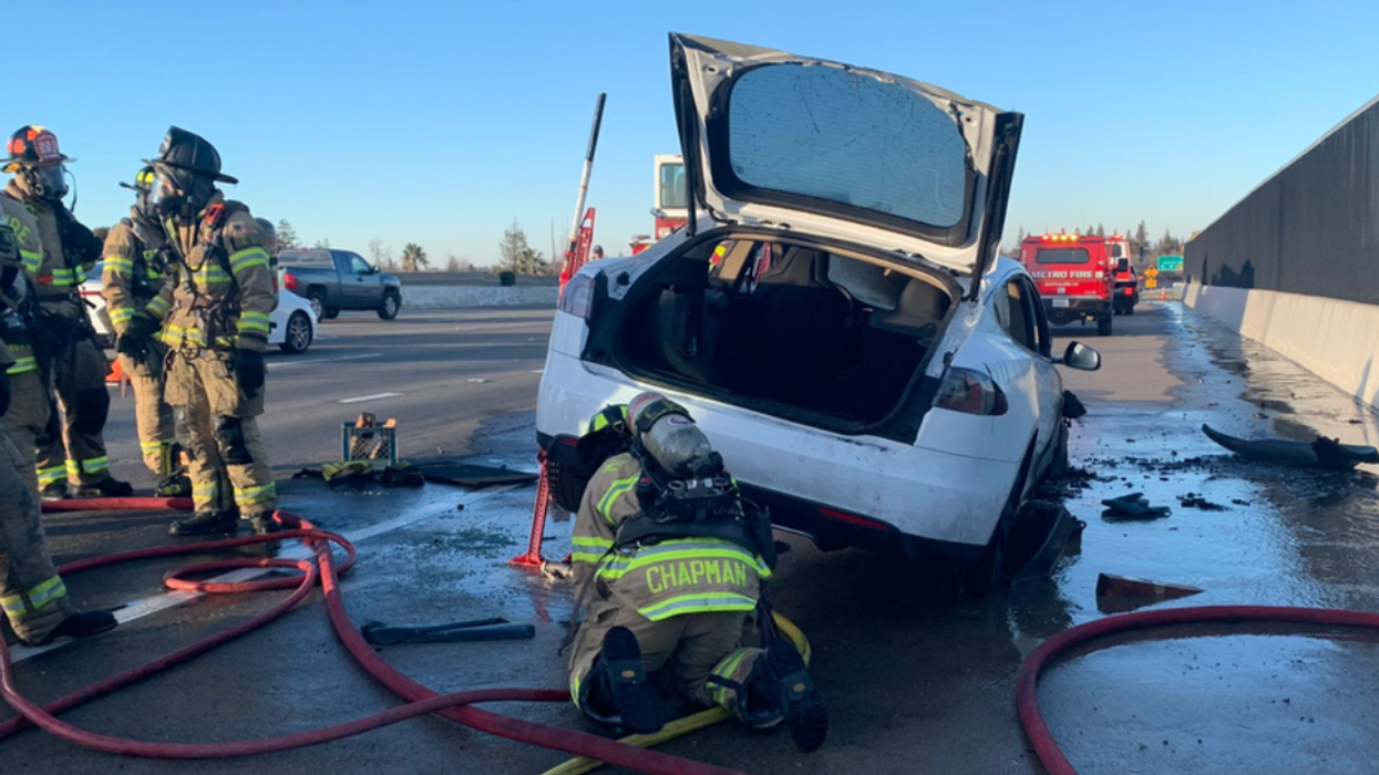 firefighters working on Tesla Model S fire
