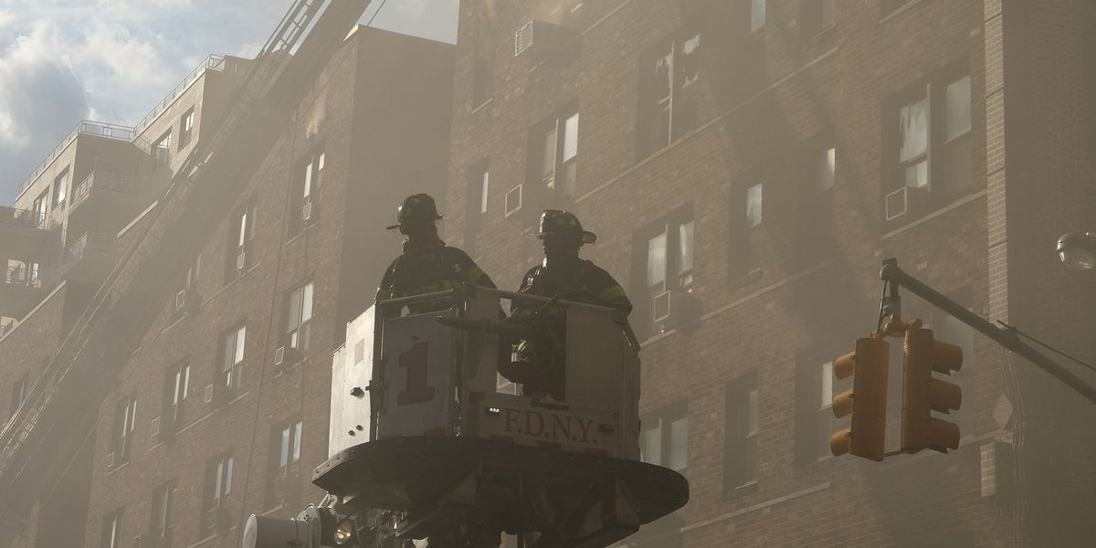 Firemen at a burning building