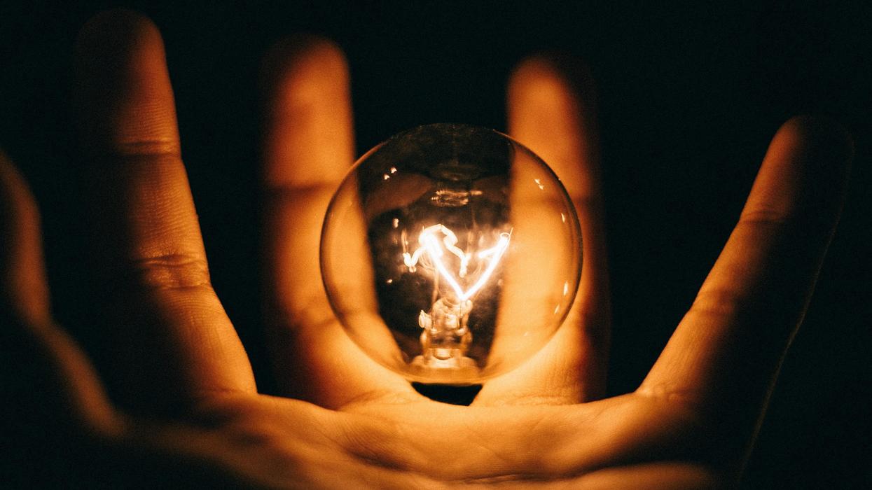 Floating illuminated lightbulb