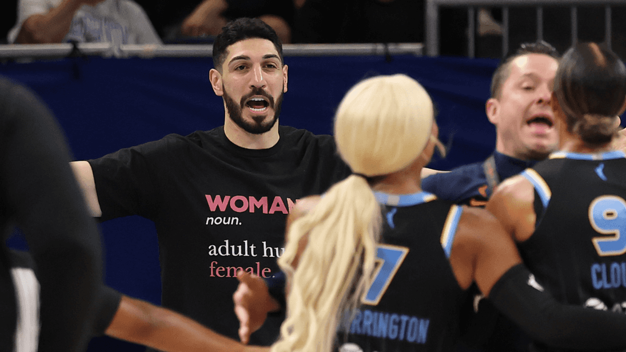 Former basketball player Enes Kanter Freedom and Natasha Cloud #9 of the Chicago Sky yell at one another.