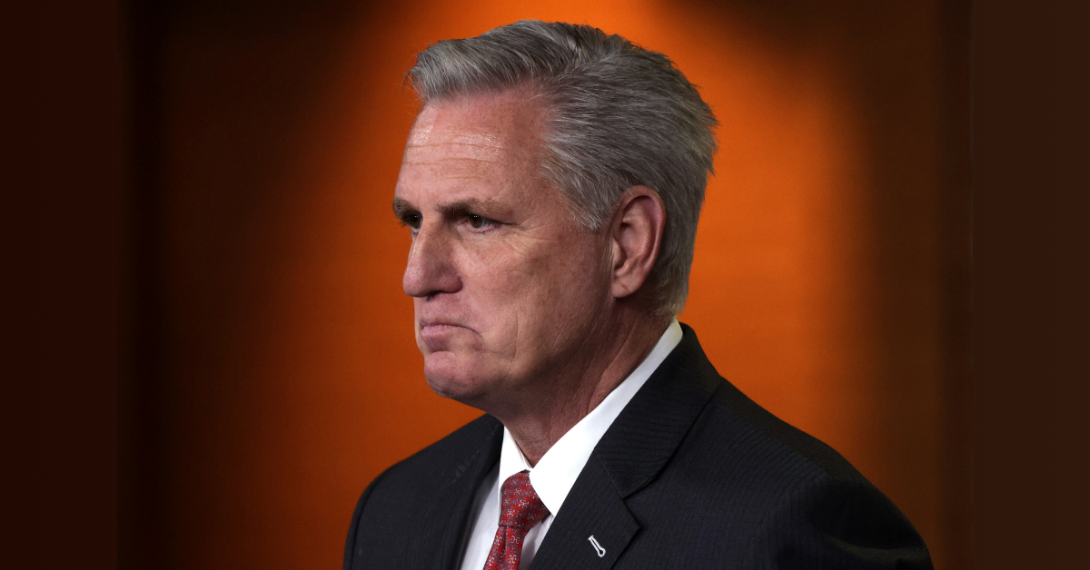 Former House Speaker Kevin McCarthy looks off-camera to the left. He is strongly frowning.