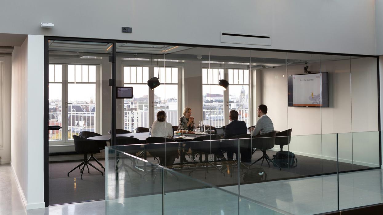Four people having a meeting