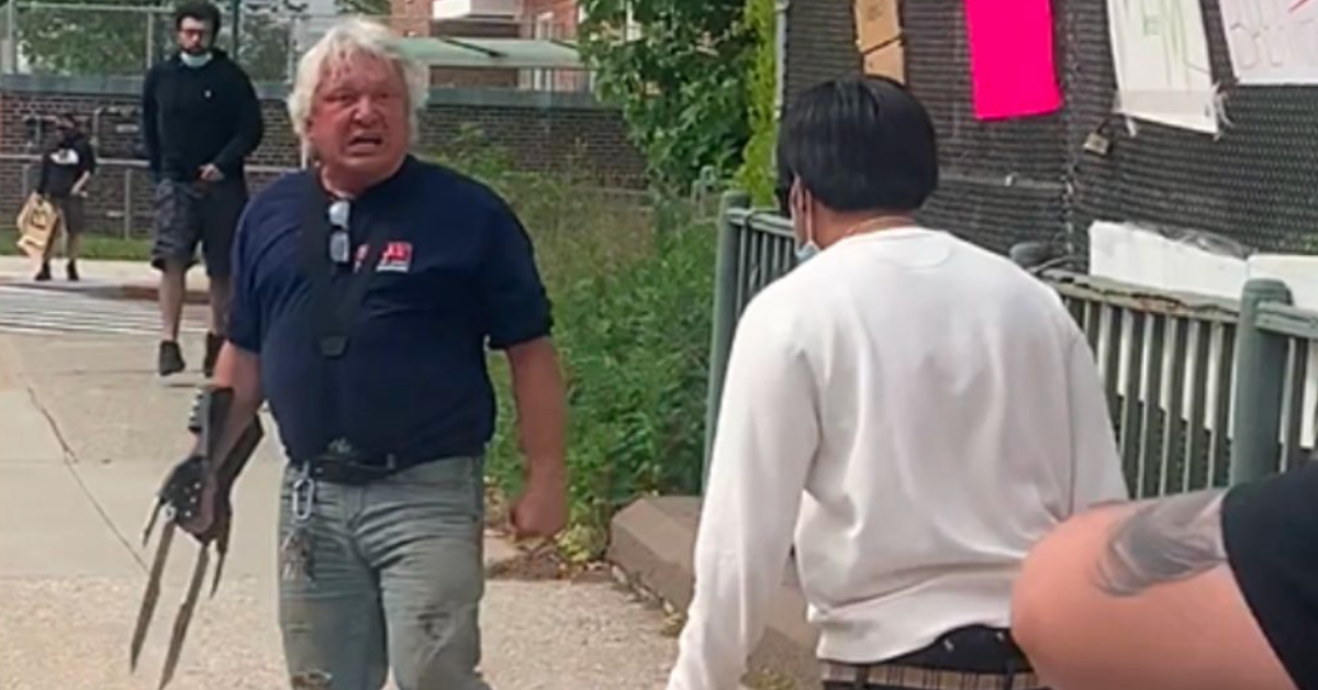 Frank Cavalluzzi wearing glove at protest