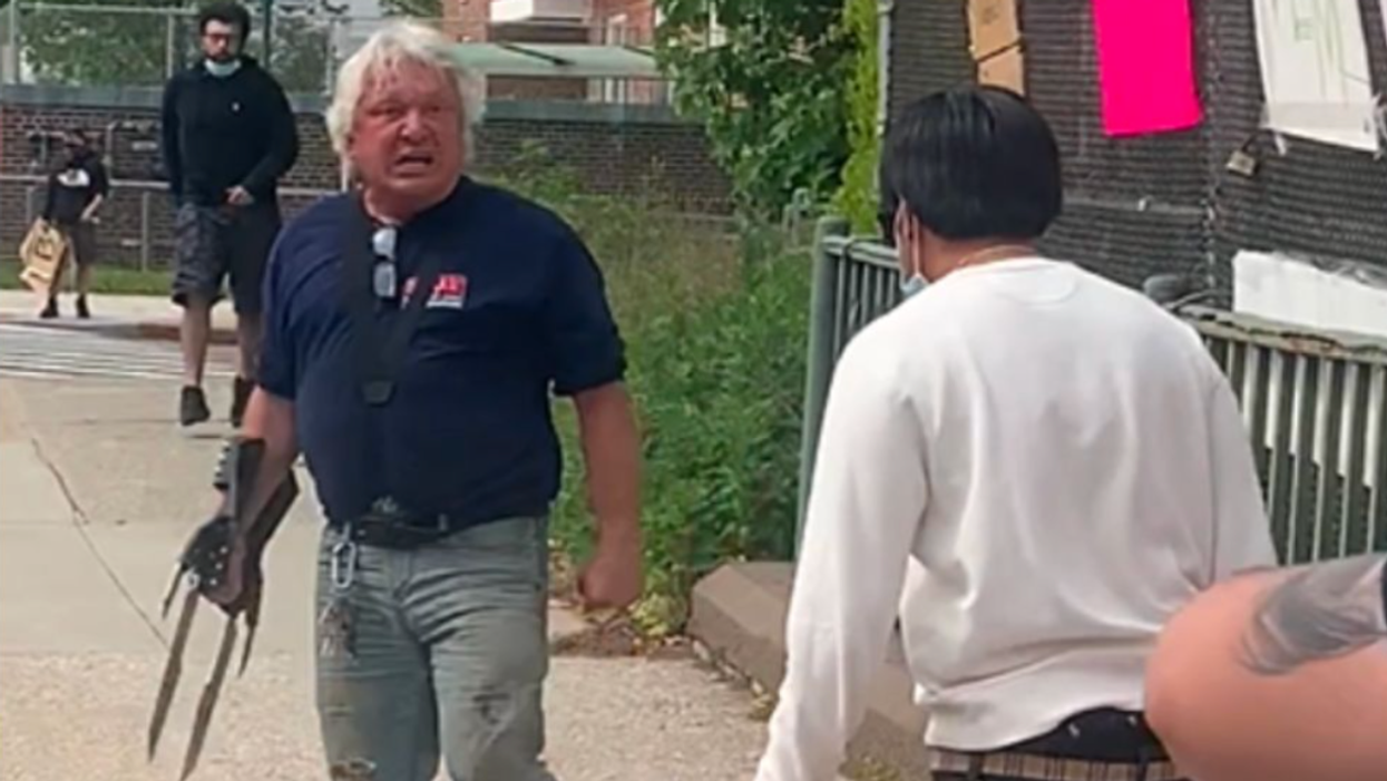 Frank Cavalluzzi wearing glove at protest